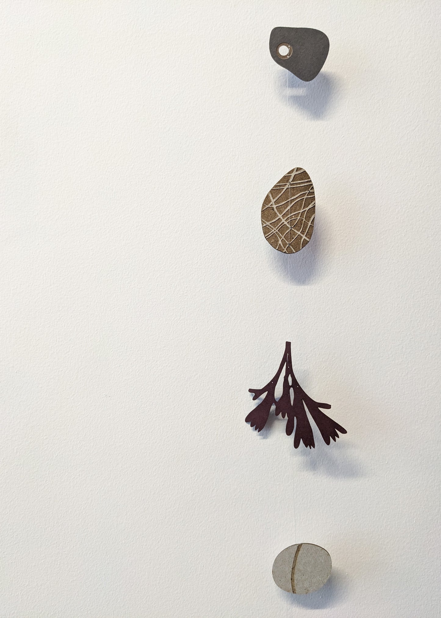 a small collection of paper pebbles & seaweed