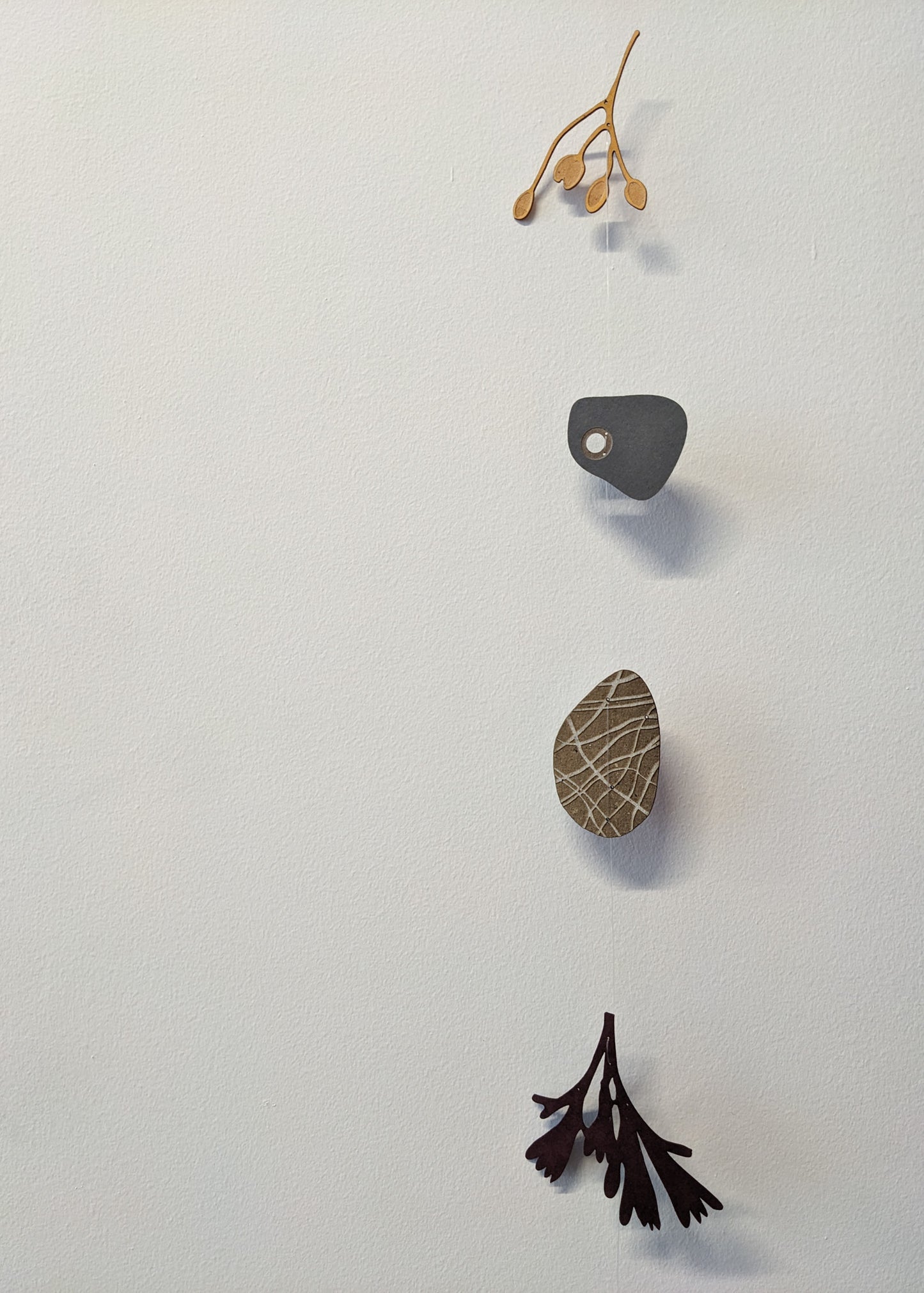 a small collection of paper pebbles & seaweed